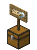 A nametag printed onto a signpost that stands atop a chest.